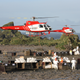 Mission staff loading bait into helicopter buckets on Macquarie Island, which lie halfway between New Zealand and Antarctica.
